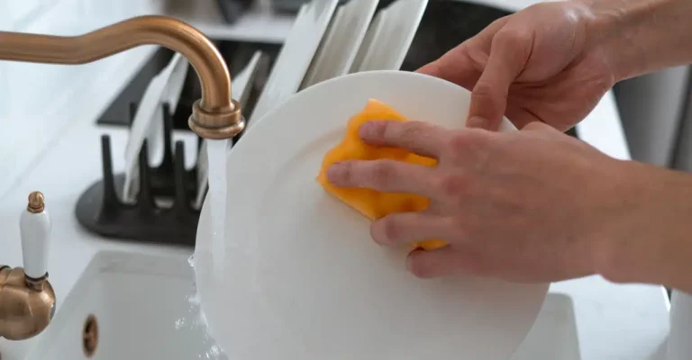 Washing dishes.